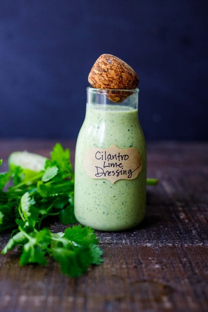 creamy cilantro dressing in a labeled jar.