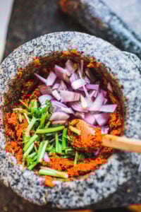 Making authentic Thai Red Curry Paste from scratch is fast and easy and can be made in under 30 minutes. Make it in a food processor or use a mortar and pestle for a more authentic approach -both yield incredible flavors and aromas that will give your Thai dishes delicious flavor. Vegan-adaptable!