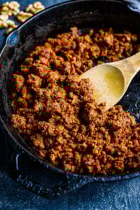 Smoky, savory, spicy Vegan Chorizo made with walnuts and lentils and Mexican Spices- a tasty plant-based alternative to chorizo to use in tacos, tostadas, quesadillas, burritos, burrito bowls, nachos or breakfast bowls. Make it ahead and keep it in the fridge for busy weeknights!