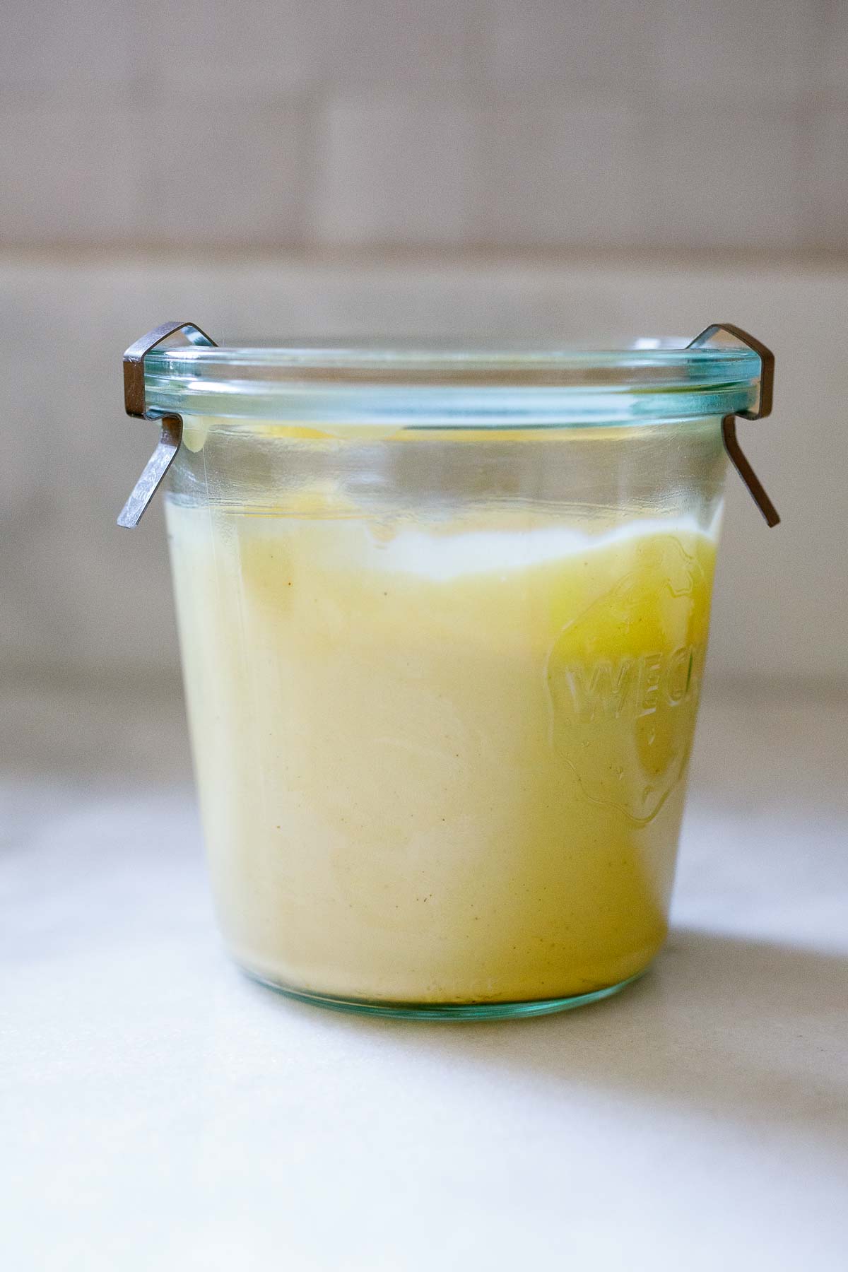 This easy mayonnaise recipe is made with olive oil, using an immersion blender right in the jar you'll store it in. Zero clean-up! It's creamy and light, great for burgers, sandwiches, dressings, and sauces.