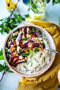This Thai Eggplant Stir Fry is a delicious healthy meal featuring succulent eggplant, your choice of protein, fresh veggies in a flavorful Thai stir-fry sauce, finished with aromatic Thai basil.