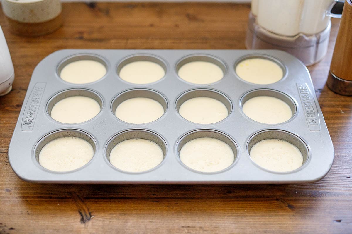 divide batter into a greased muffin tin.