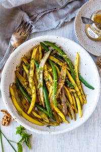 Green beans with Toasted Walnut Vinaigrette, a simple, delicious side dish that will enhance almost any meal. Vegan and Gluten-free.
