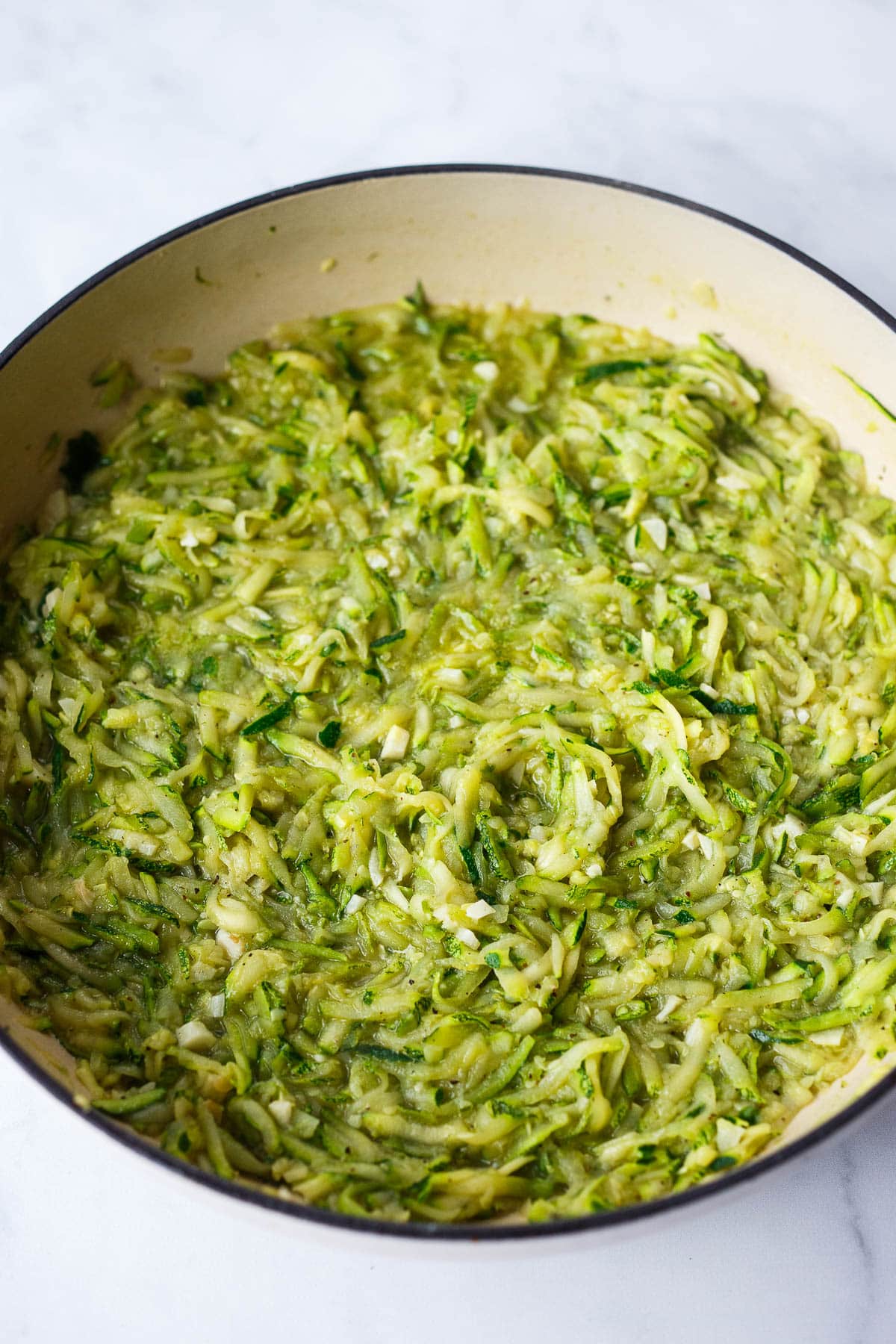 Zucchini sauce simmering in a brasier.