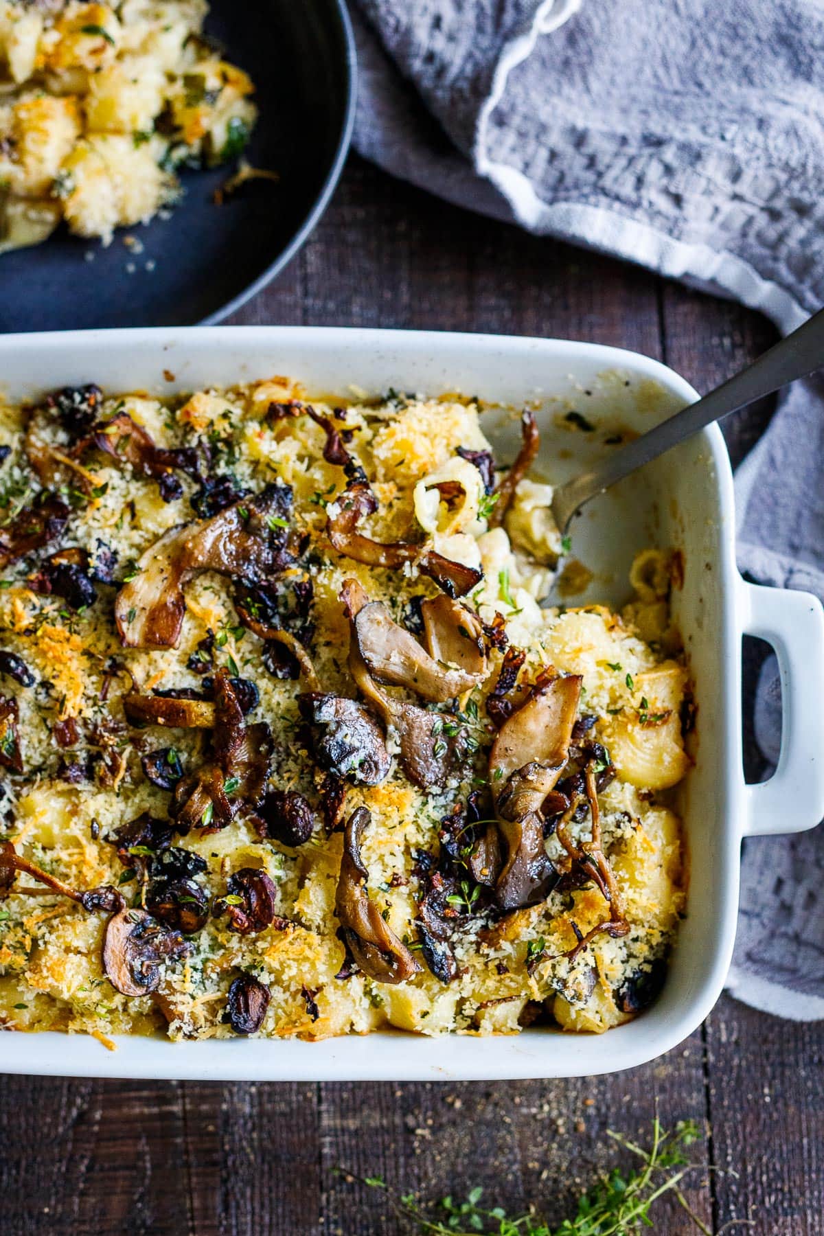 Golden and bubby Truffle Mac and Cheese being served.