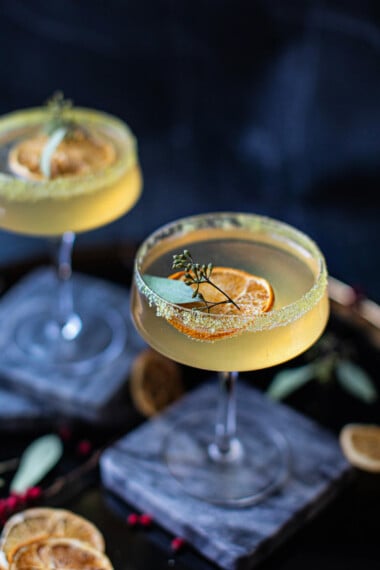 orange blossom cocktail with dried orange blossom cocktails with garnish on top