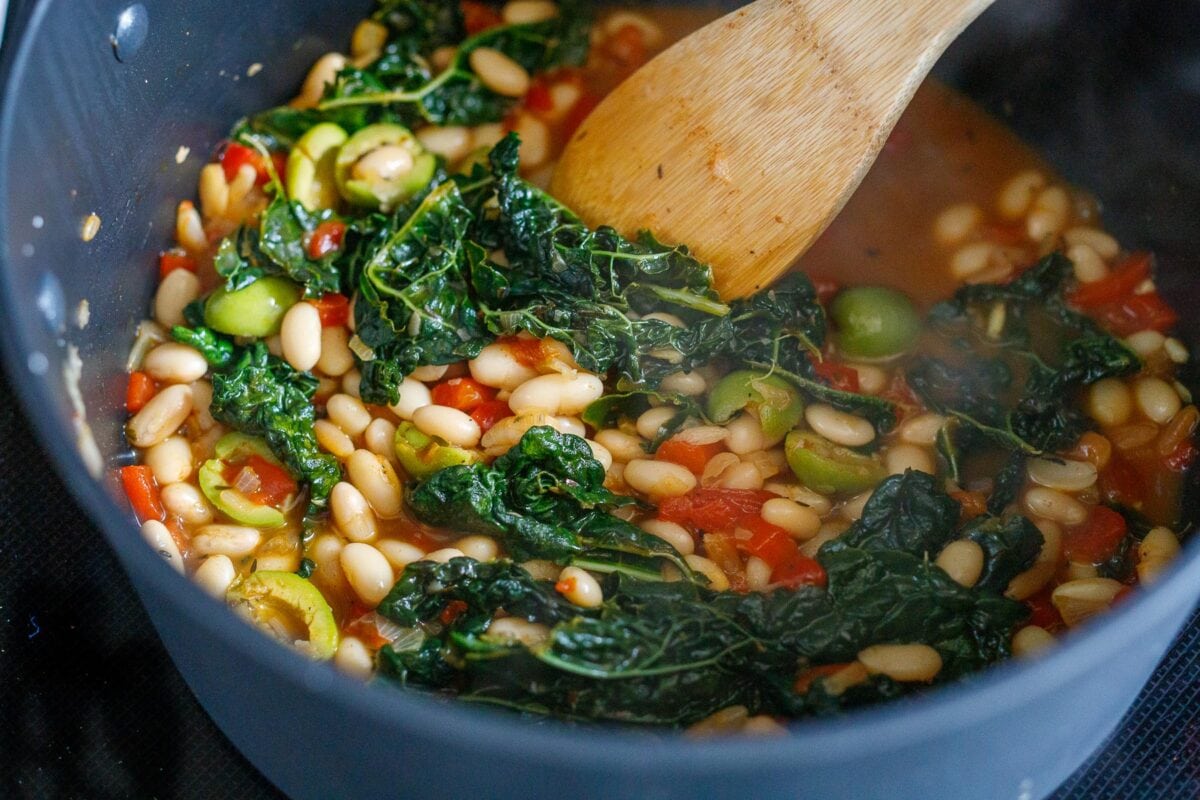 stirring the the brothy beans