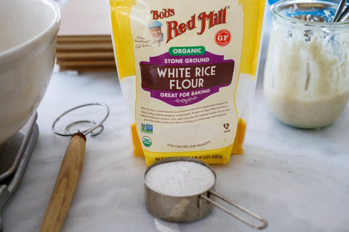 Adding flour to the bowl.