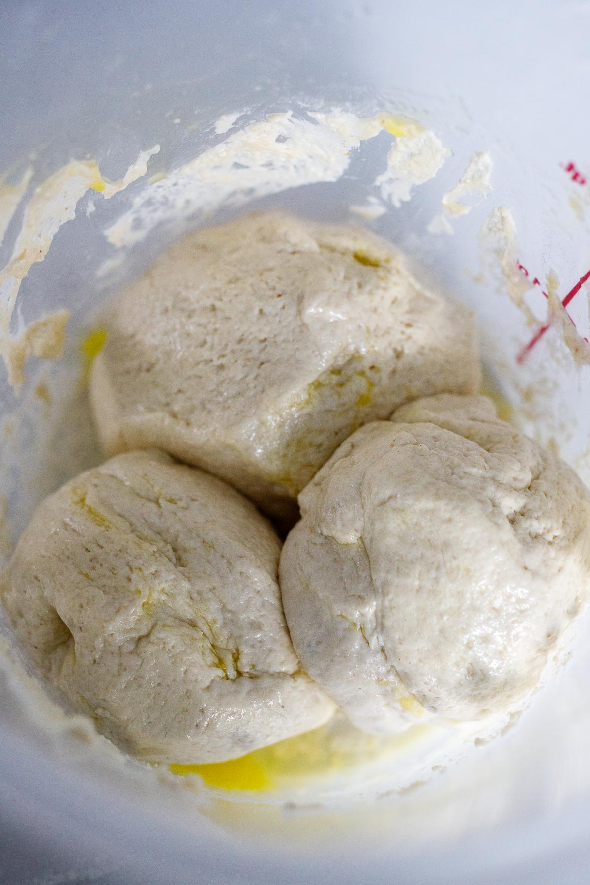 Storing 3 balls of dough in the container to use later.