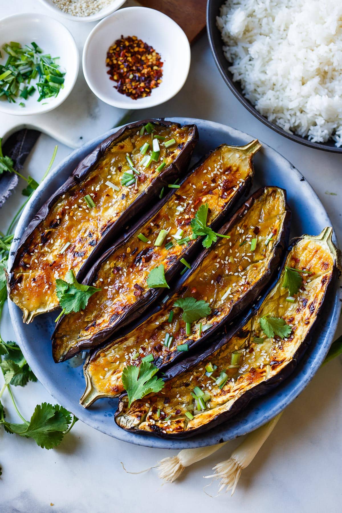 Miso Eggplant (Nasu Dengaku) with Mizo glaze on a blue plate.