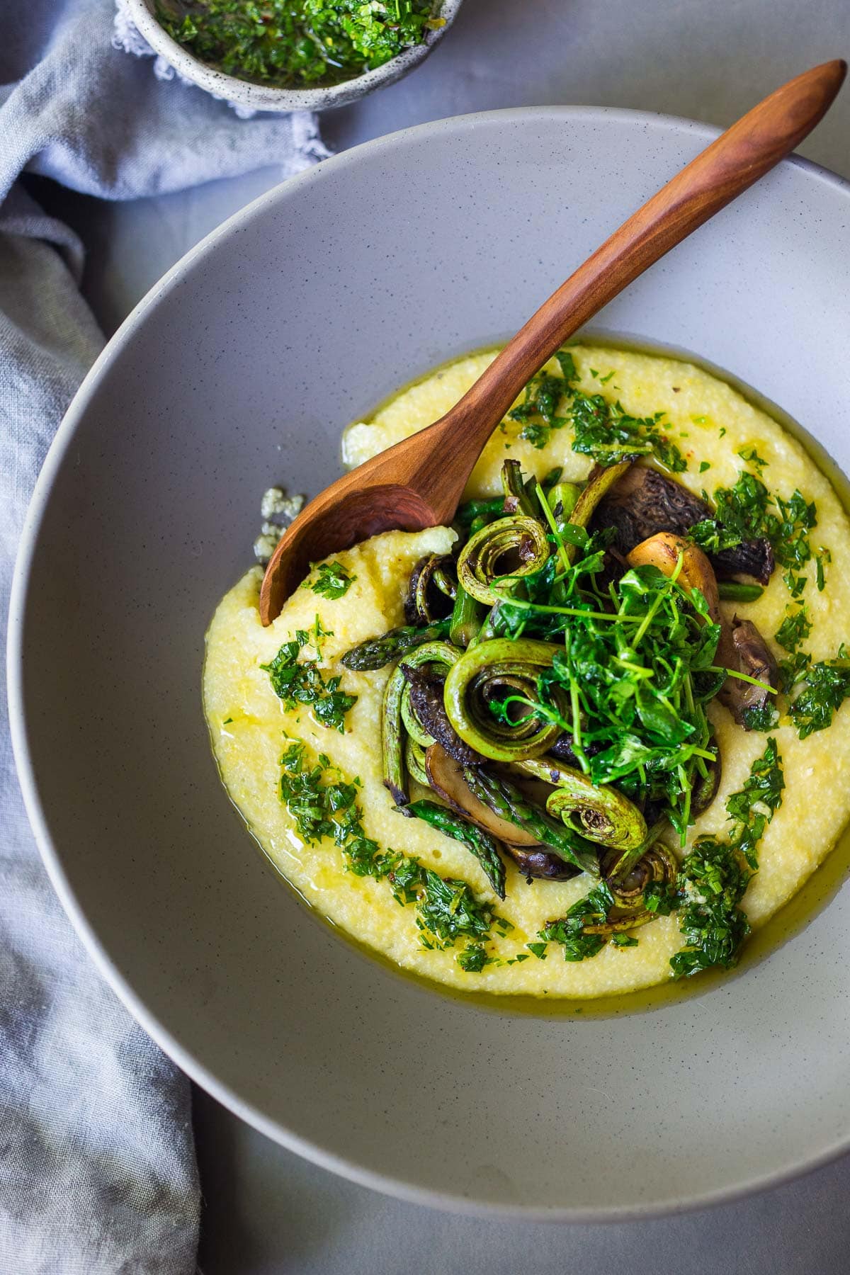 40 Spring Recipes: Polenta in a bowl with spring veggies.
