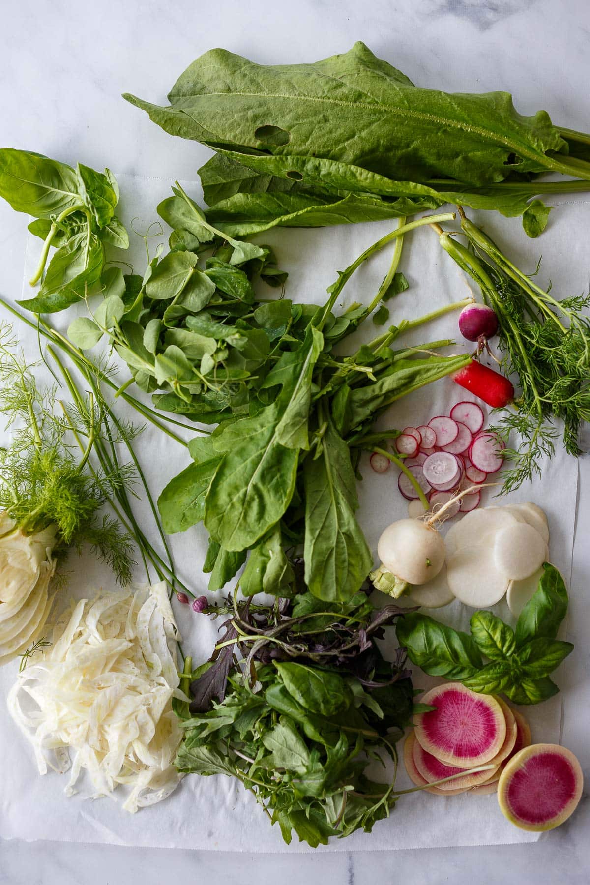 Chopped ingredients for the spring salad recipe.