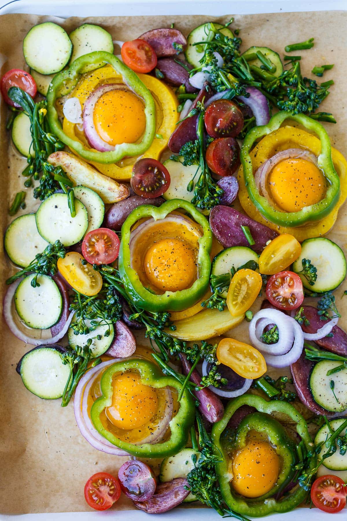 assembling the baked eggs on the sheet pan.