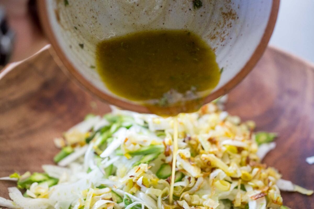 Adding dressing.