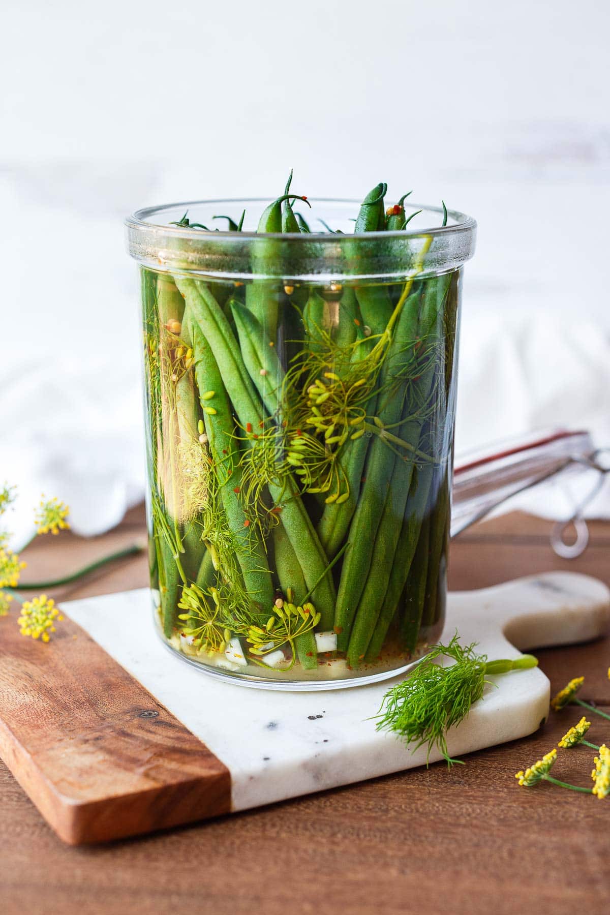 How to make Dilly Beans- a quick and easy recipe for pickled green beans that can be used in Bloody Marys, on charcuterie boards and cheese boards, or serve as a tasty snack.