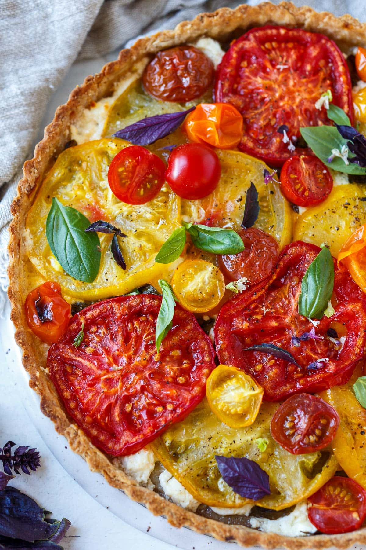 Fresh Tomato Tart with basil and a flaky olive oil crust.