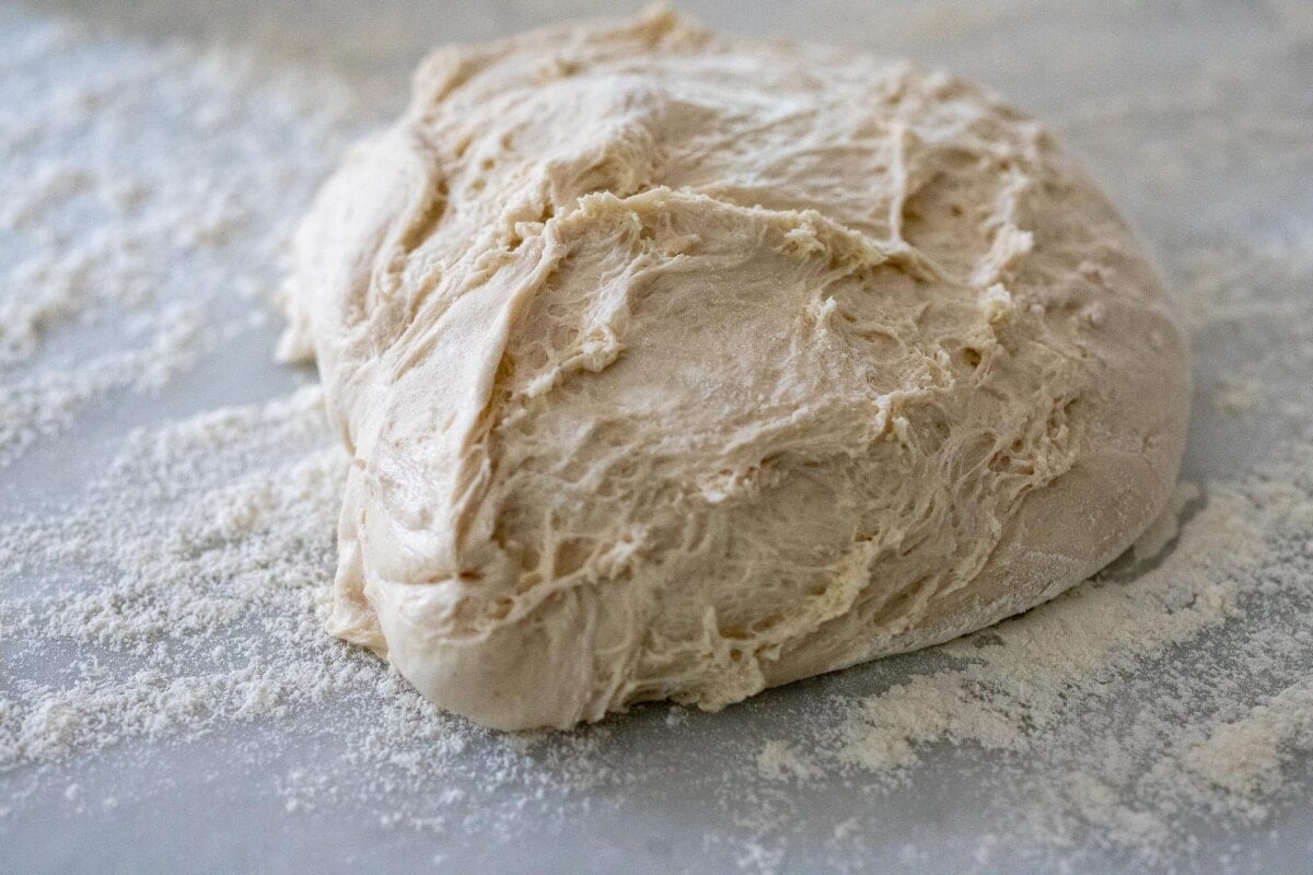 ball of dough on floured surface.