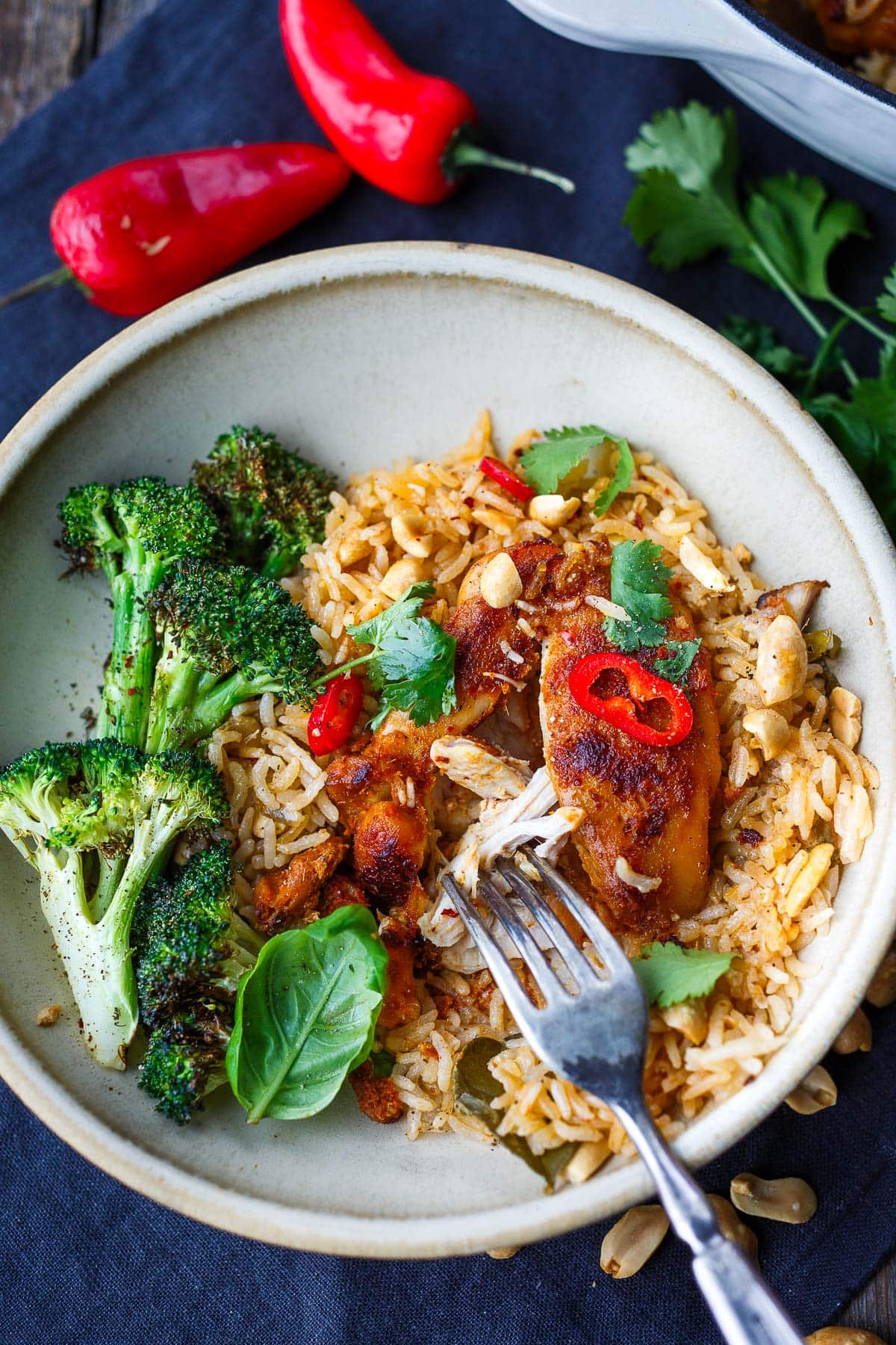 oven-baked chicken and rice recipe with thai red curry served in a bowl.