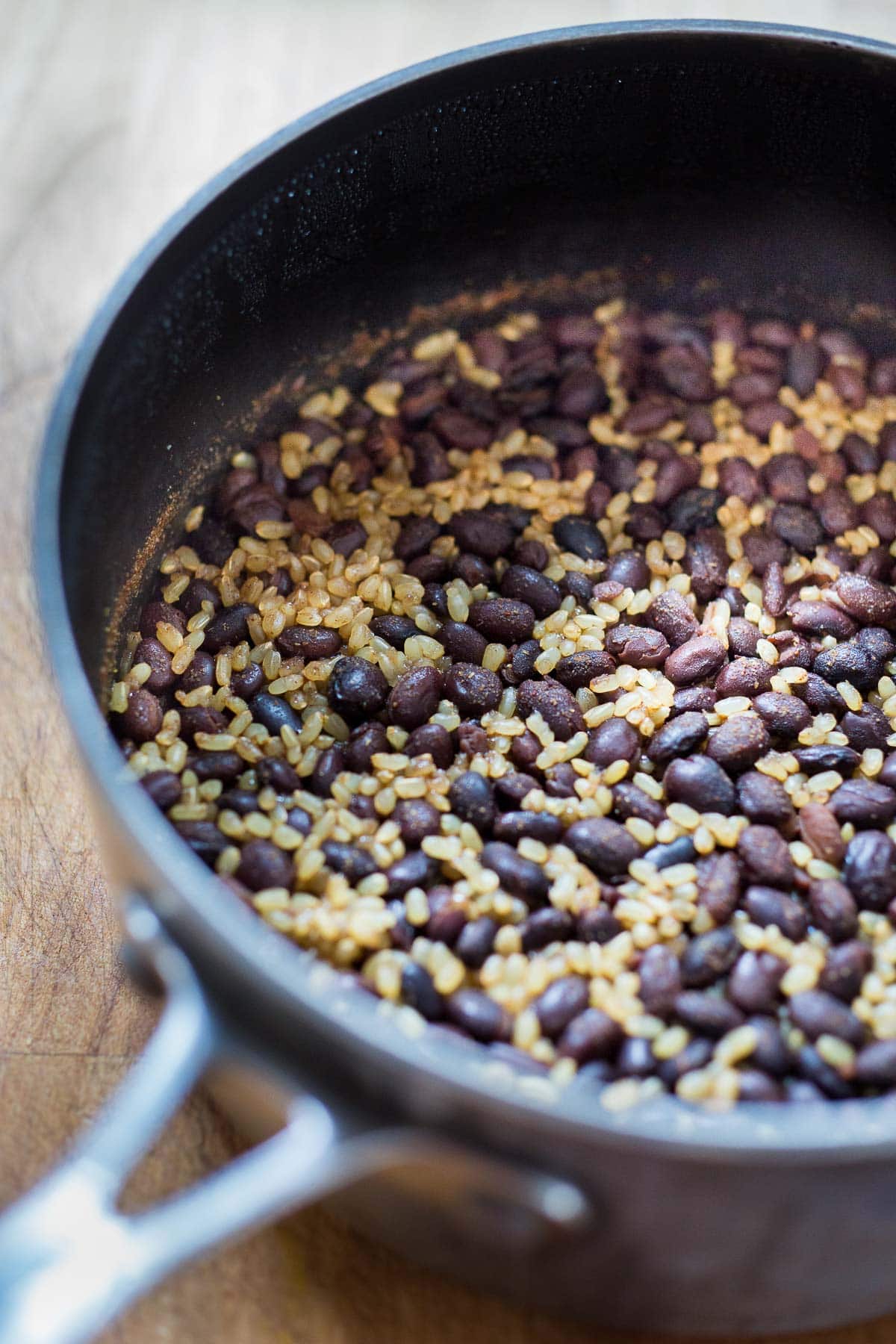cooked rice and beans in a pot.