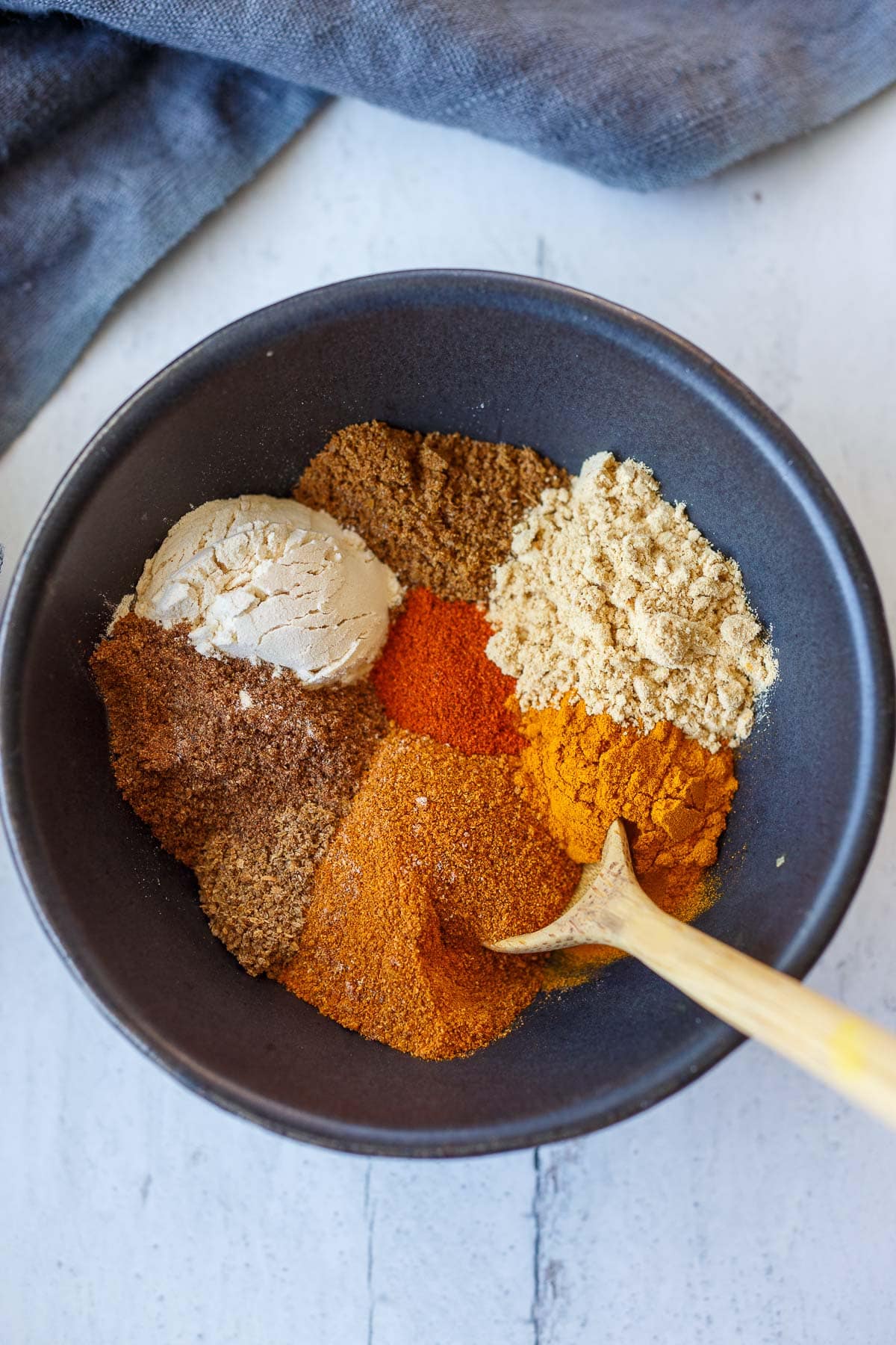 various colorful spices in small dish to make shawarma spice mix.