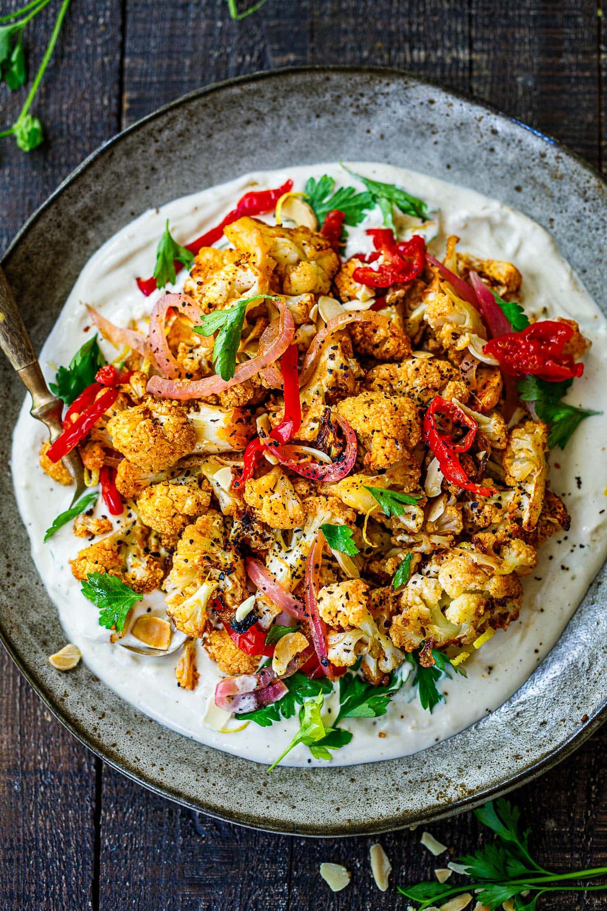 Crispy air fryer cauliflower over yogurt tahini sauce. 