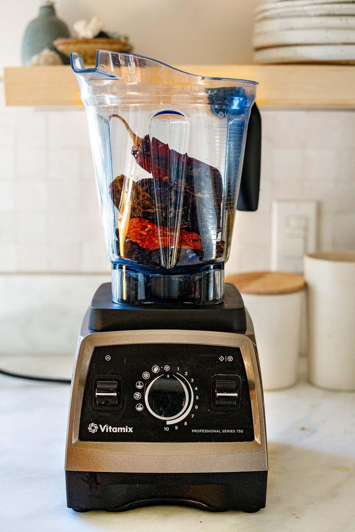 vitamix with dried chiles, for making chile powder from scratch.