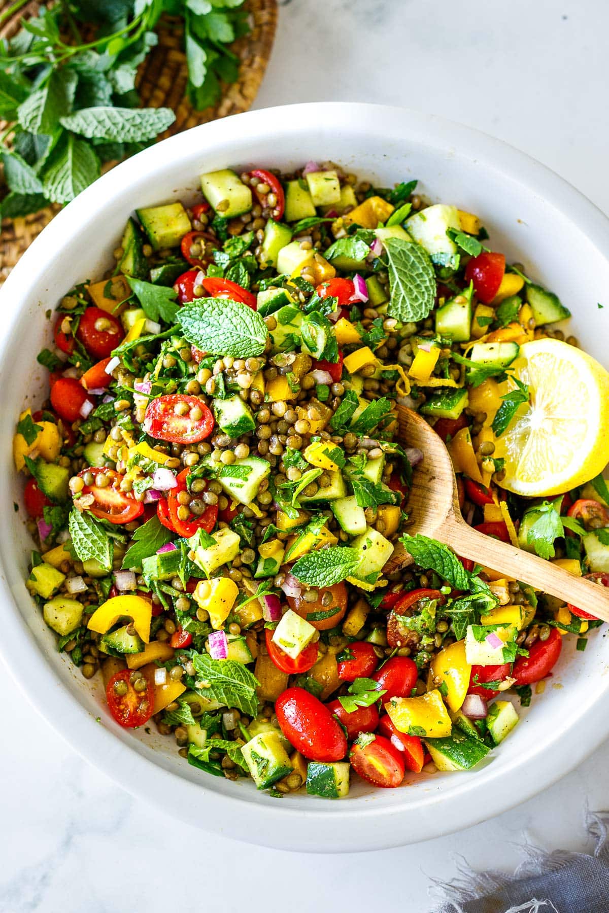 This Mediterranean-inspired lentil salad recipe is bursting with flavor! Cold and refreshing, it's made with simple ingredients in 30 mins!