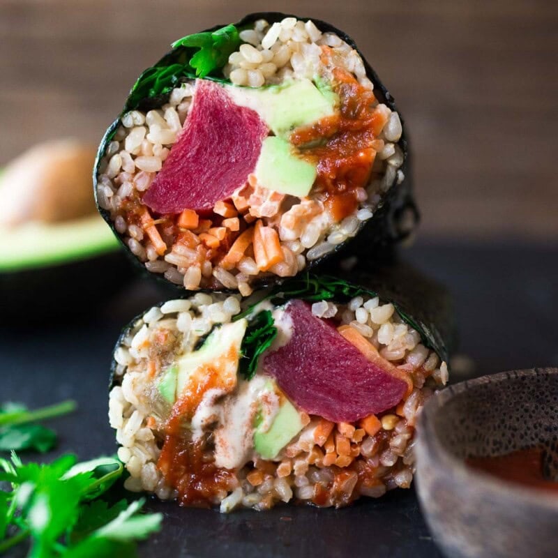 Delicious, easy Sushi Burritos! Sushi Rice, avocado, ahi, (or salmon or tofu) and veggies, wrapped up with Nori into a tasty healthy burrito!