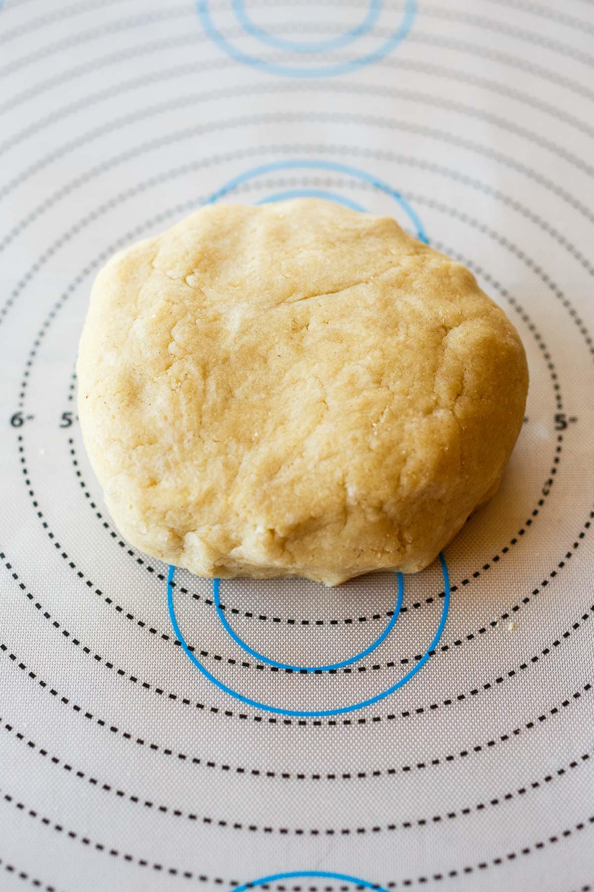 vegan tart dough formed into a ball on silicone mat.