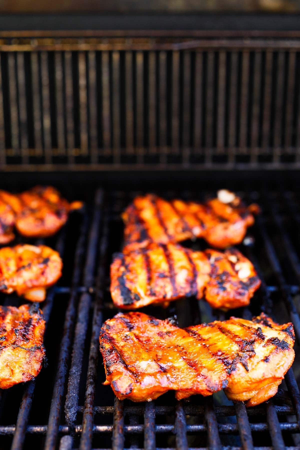 grilled Korean bbq chicken on grill. 