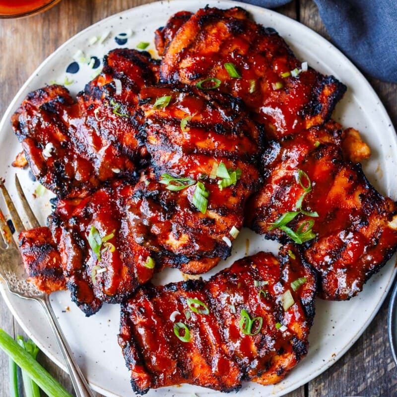 Succulent and bursting with flavor this Korean BBQ Chicken recipe is slathered with an easy homemade Korean BBQ sauce and grilled to perfection.