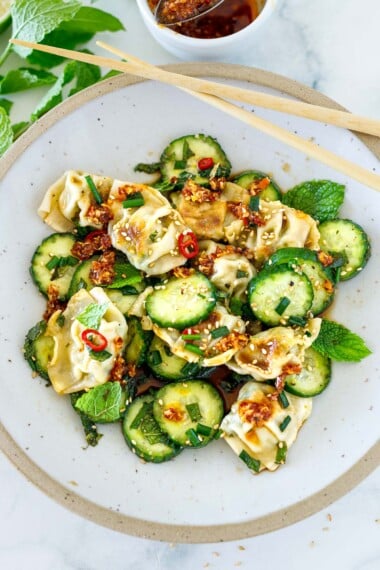 Here's a punchy, refreshing Wonton Salad recipe I've been making all summer long! Crispy wontons are tossed with crisp cucumbers, ginger, chilies, chives, garlic, and fresh mint in a simple Asian Dressing.