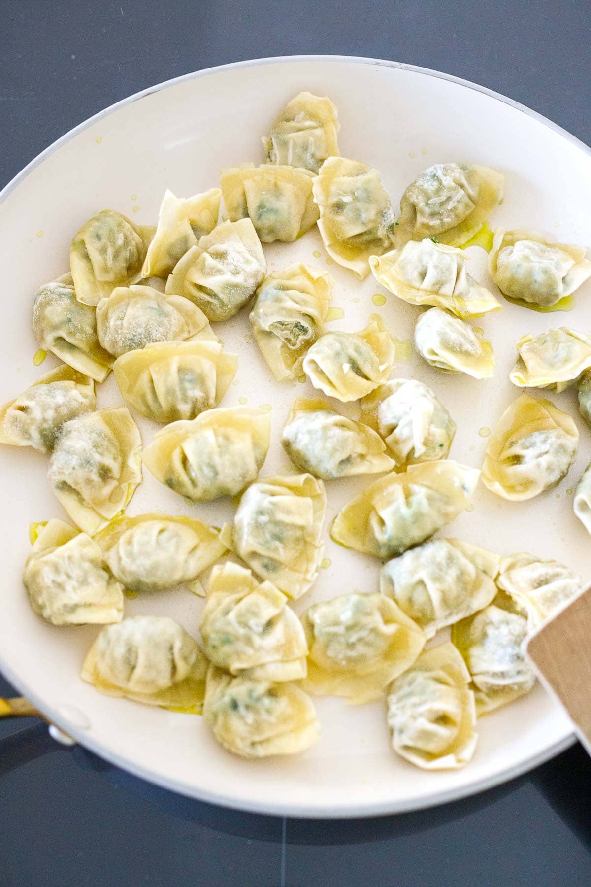 frozen mini wontons in skillet. 