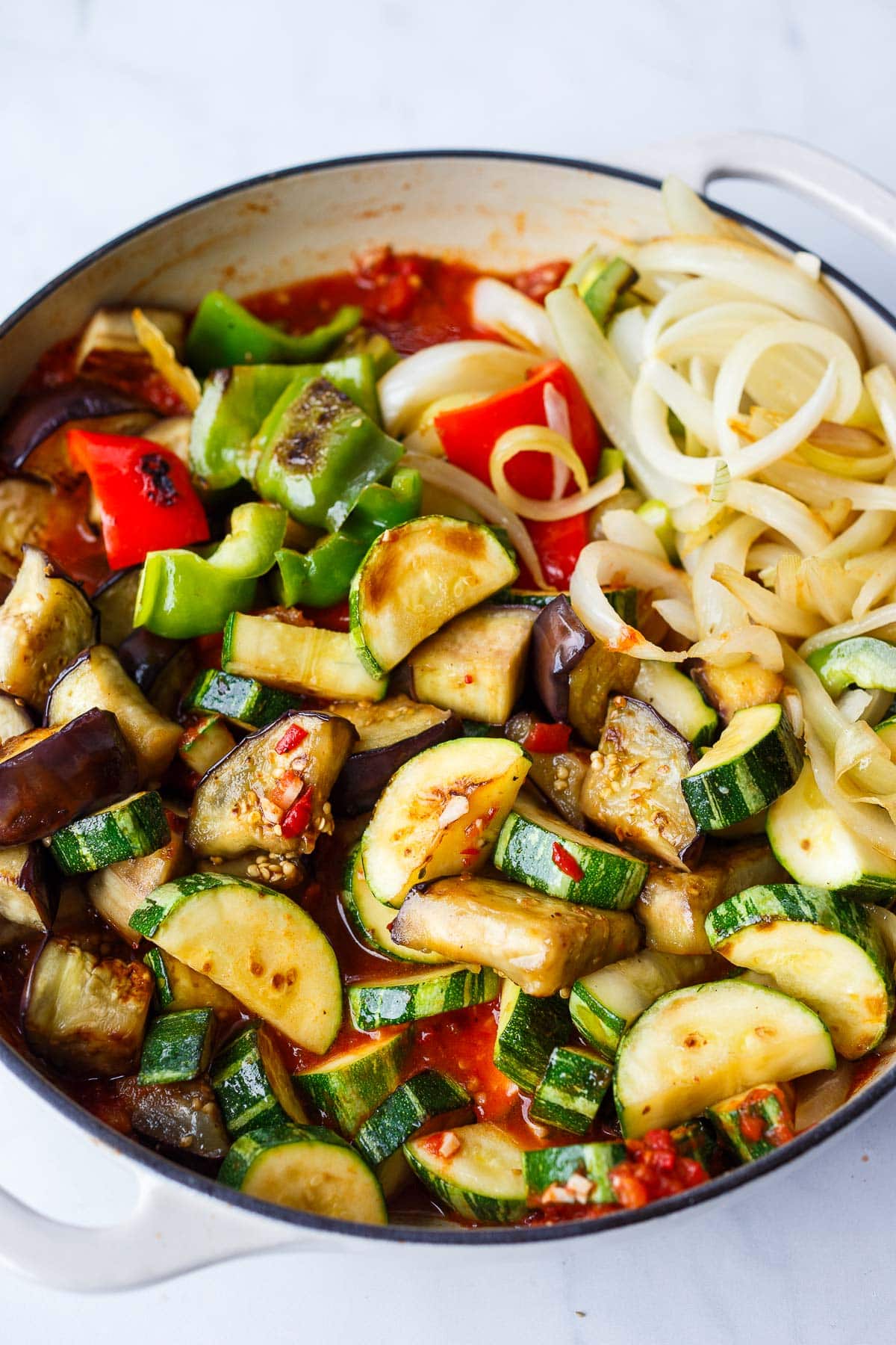 pot of ratatouille vegetables cooking in tomato sauce.
