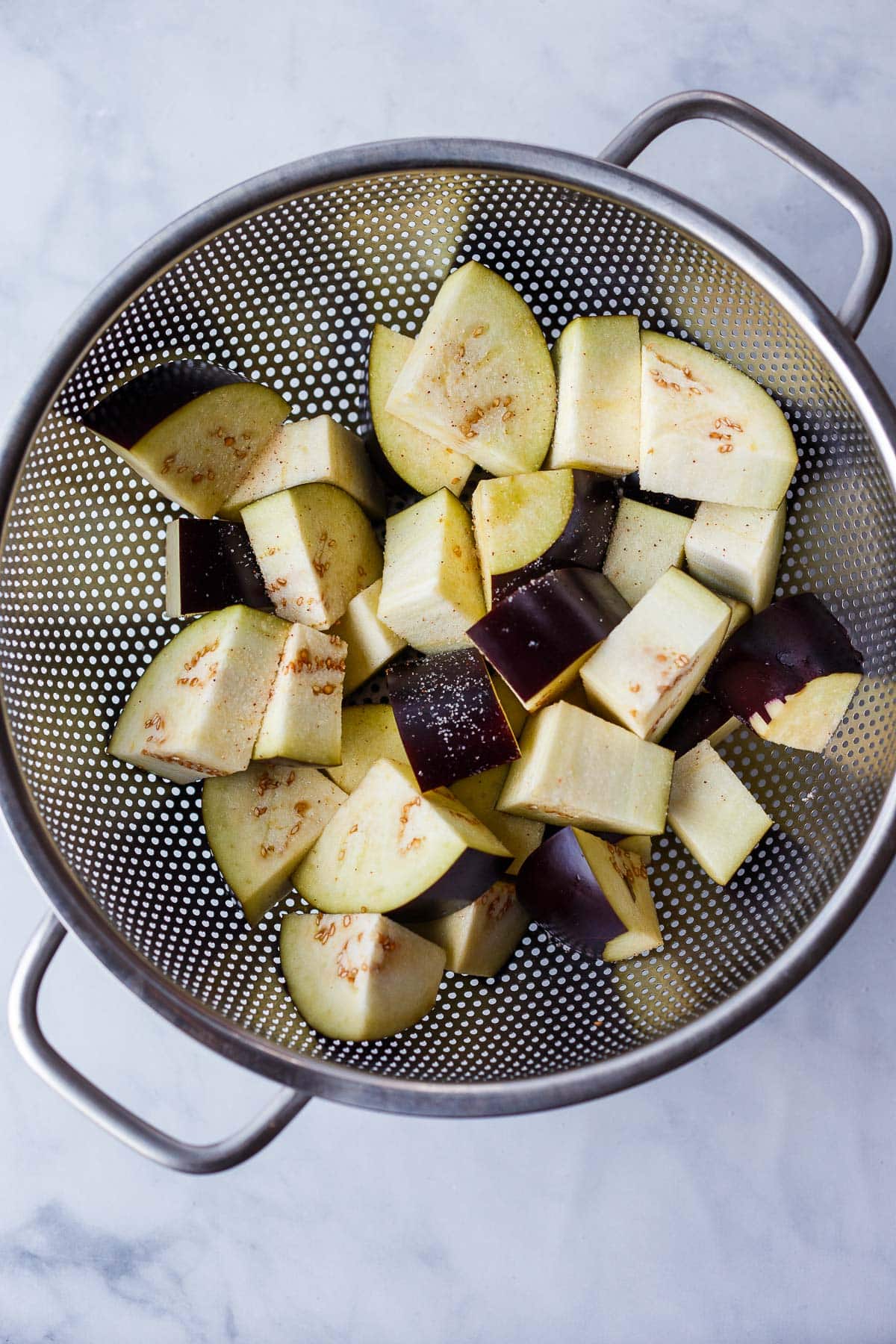 chopped and salted zucchini in colander.