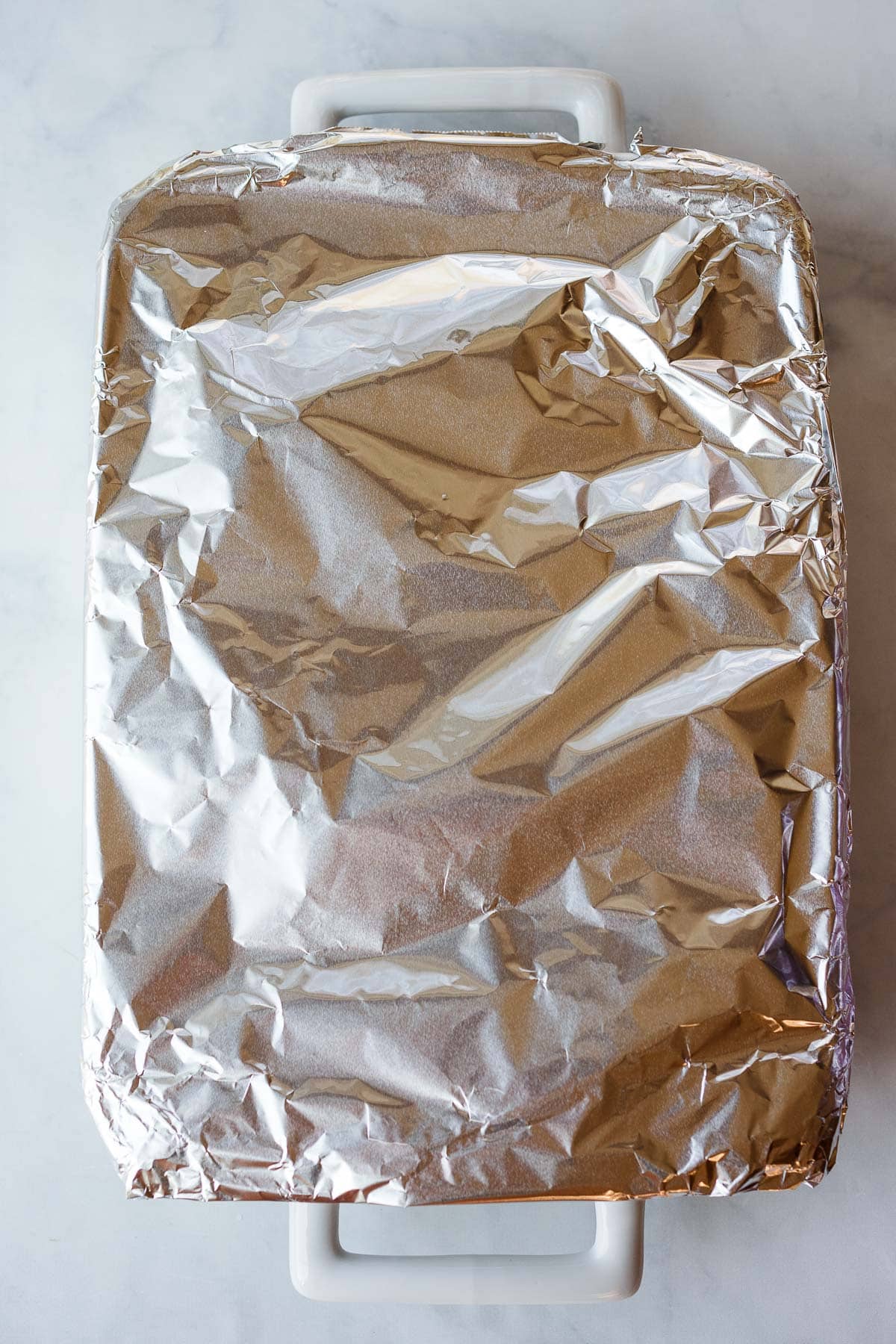 rectangular baking dish covered with foil.