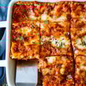 This classic lasagna recipe is absolutly delectable! Made with a rich tomato-meat sauce, three kinds of cheeses, and savory Italian spices, it's easy to make and always a crowd-pleaser.