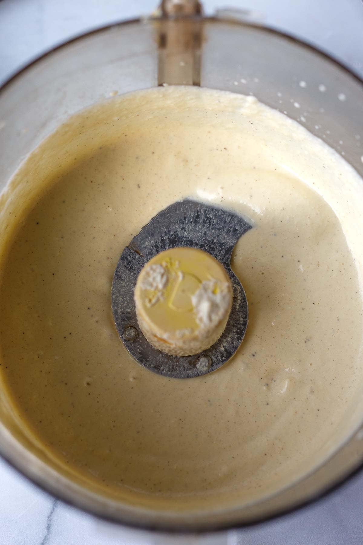 food processor with blended almond yogurt. 