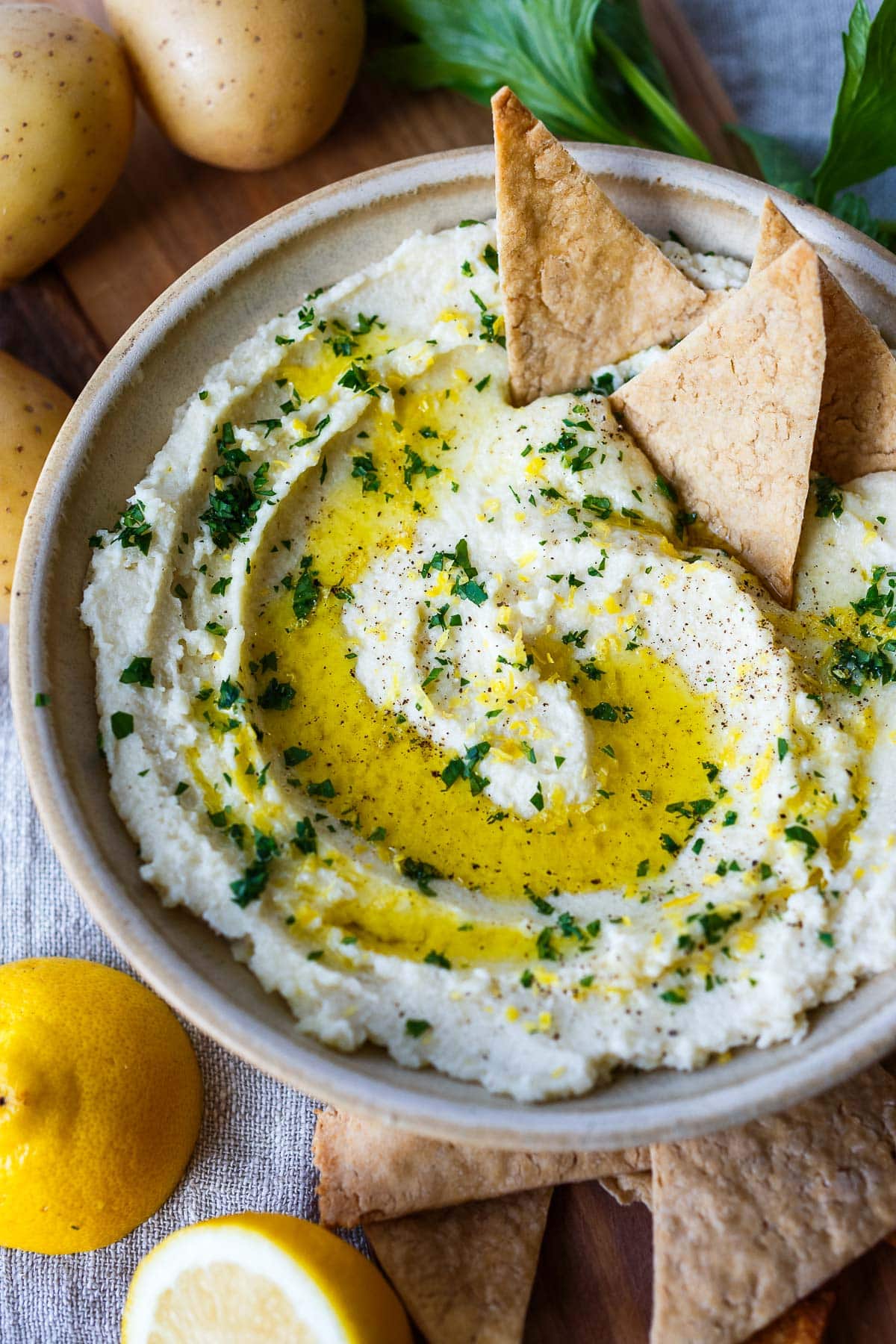 skordalia with a swirl of olive oil, minced parsley, lemon zest, and pita chips. 