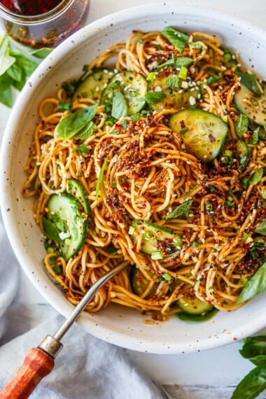 Easy to make and loaded with flavor, this cold noodle salad with cucumber and chili crisp satisfies all our spicy umami cravings in one delicious bite! Vegan.