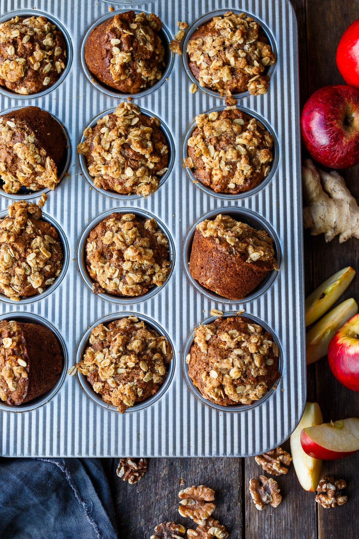 baked apple oat muffins in muffin tin.