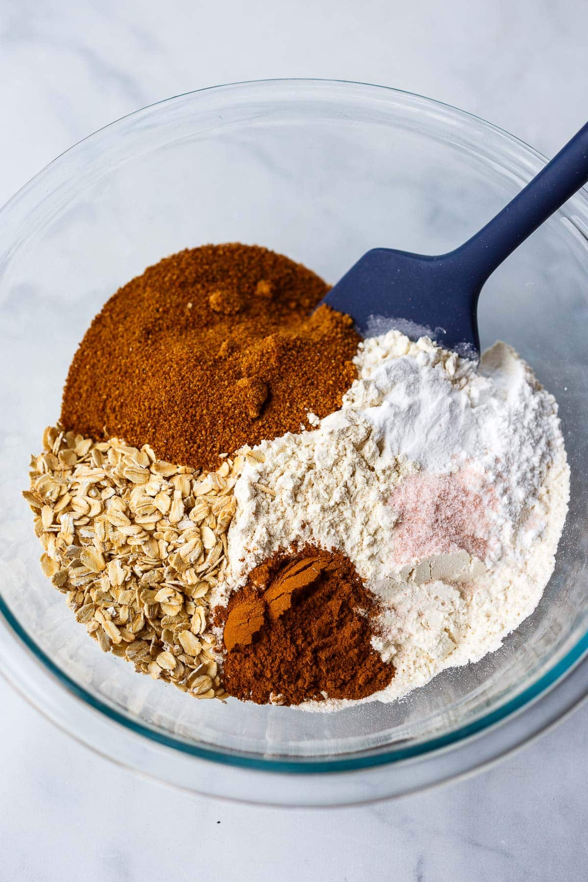 sugar, oats, flour, salt, baking powder in a glass bowl.