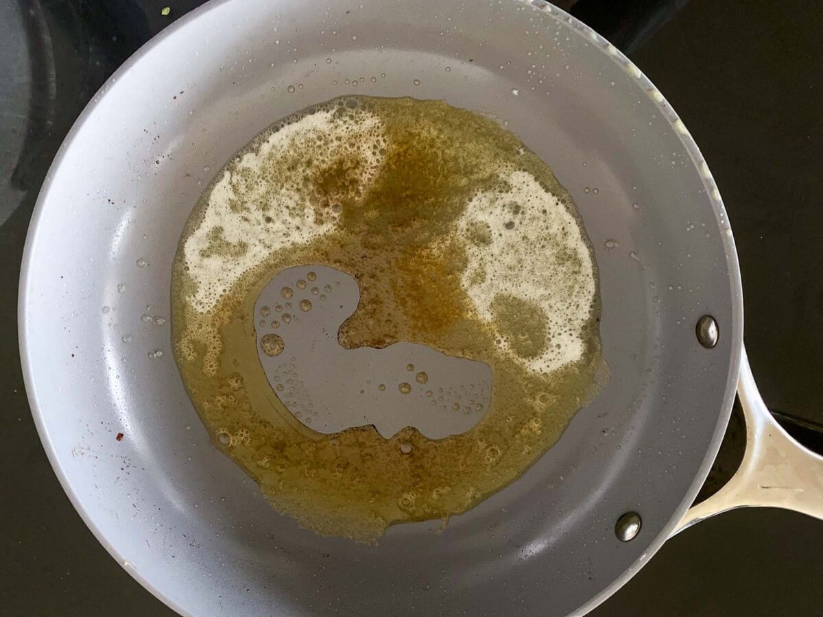 butter melting in skillet.