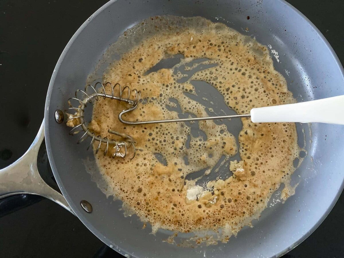 whisk stirring flour and butter mixture.