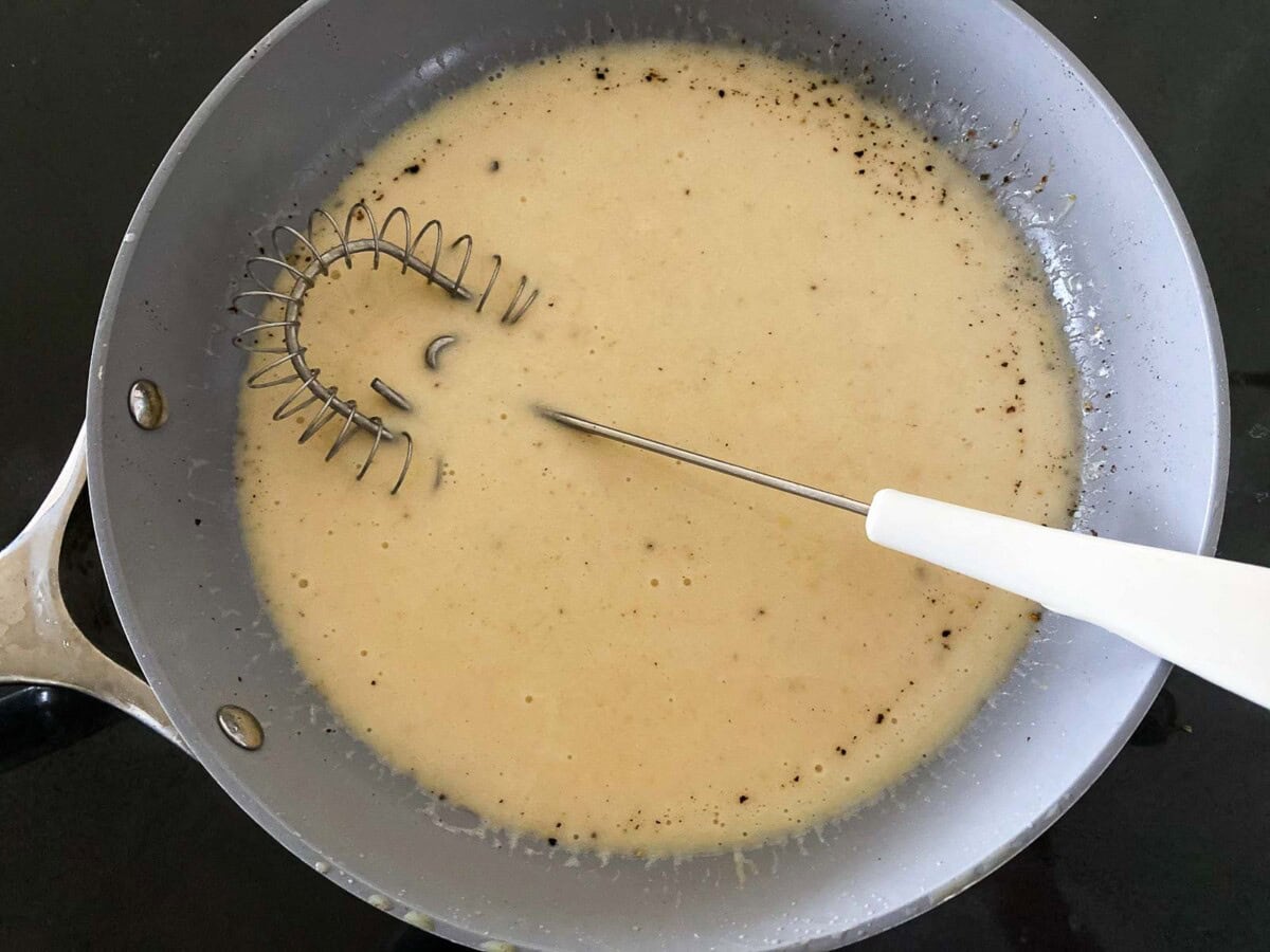 skillet with flour slurry and whisk.