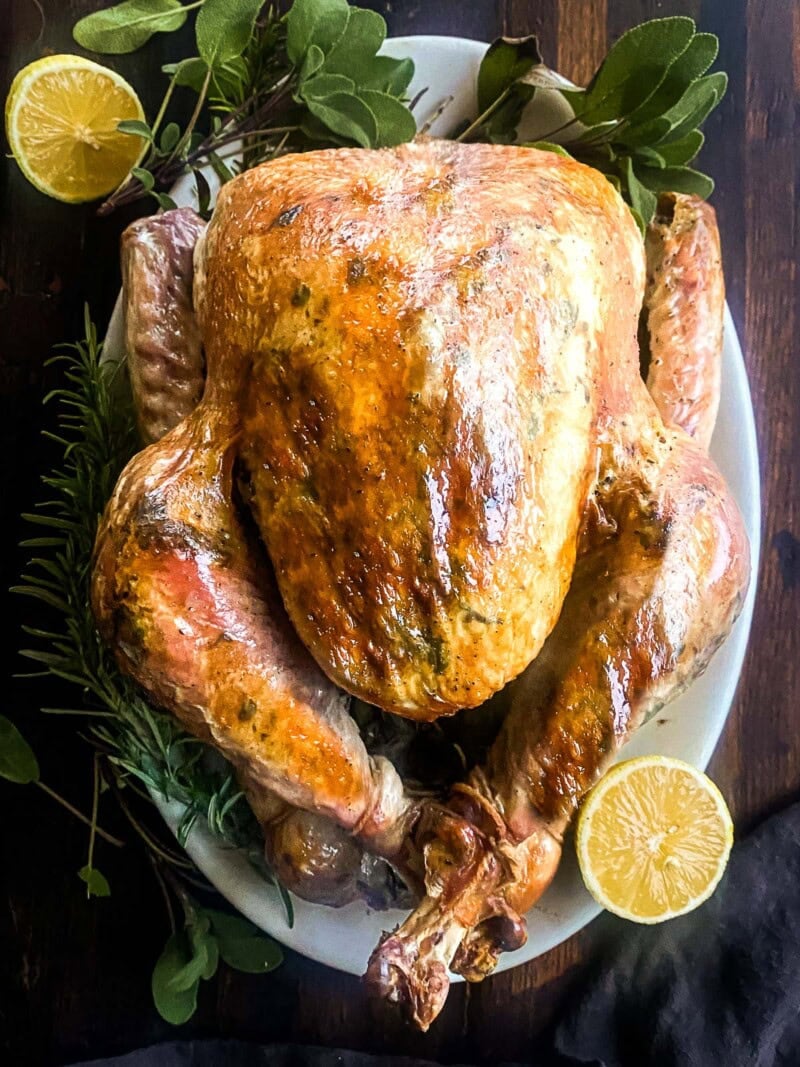 This Roast Turkey recipe is made with fresh herb butter infused with garlic and lemon zest, a simple, no-fuss Martha Stewart recipe that turns out tender and delicious every time!