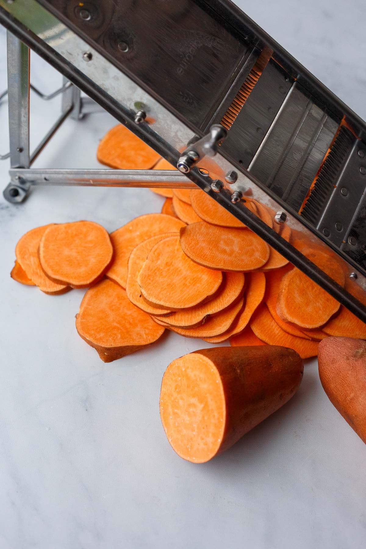slicing yams with mandoline. 