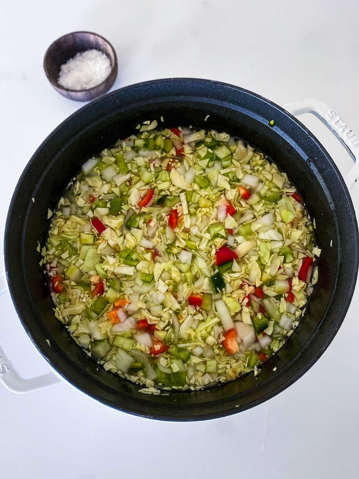 large pot with chow chow chopped veggies submerged in water.
