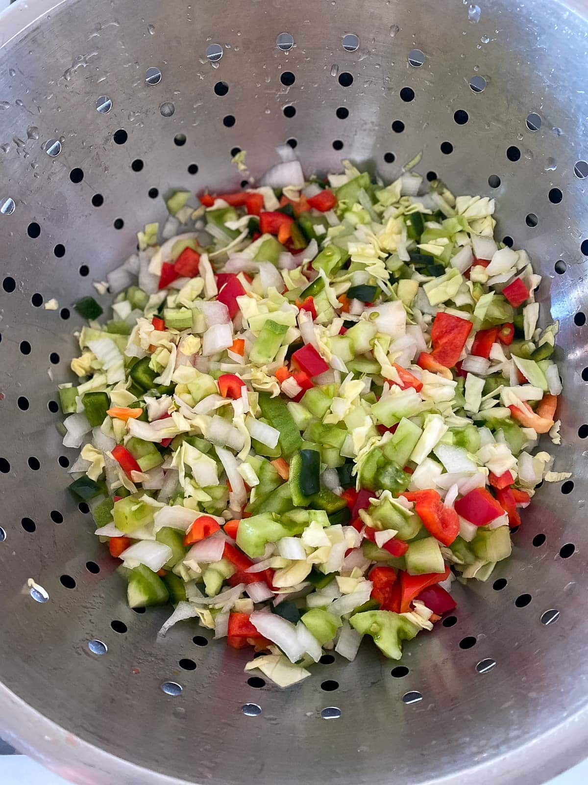 chow chow veggies draining in colander. 