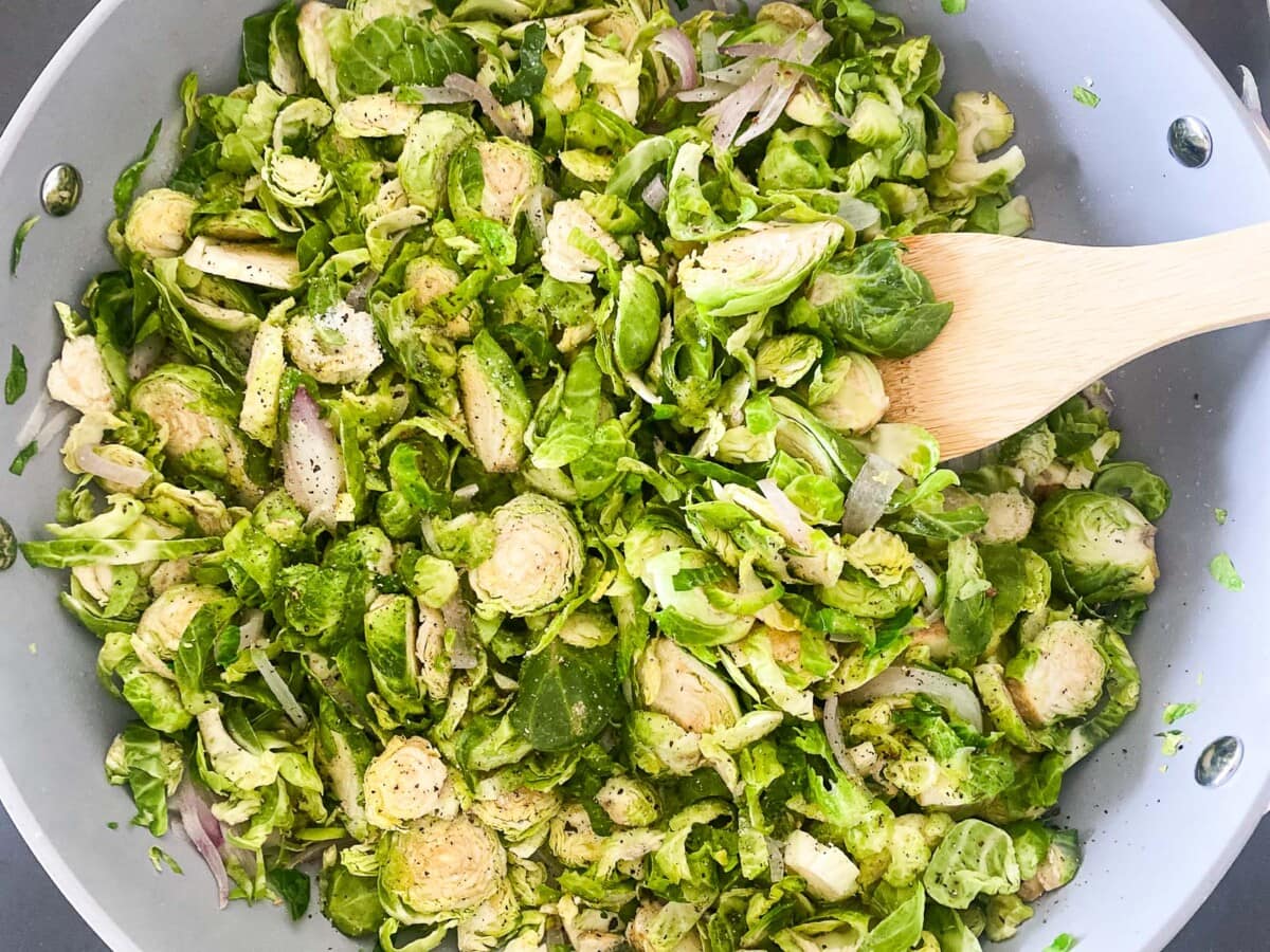 skillet with shredded Brussels sprouts and sauteed shallots and garlic. 
